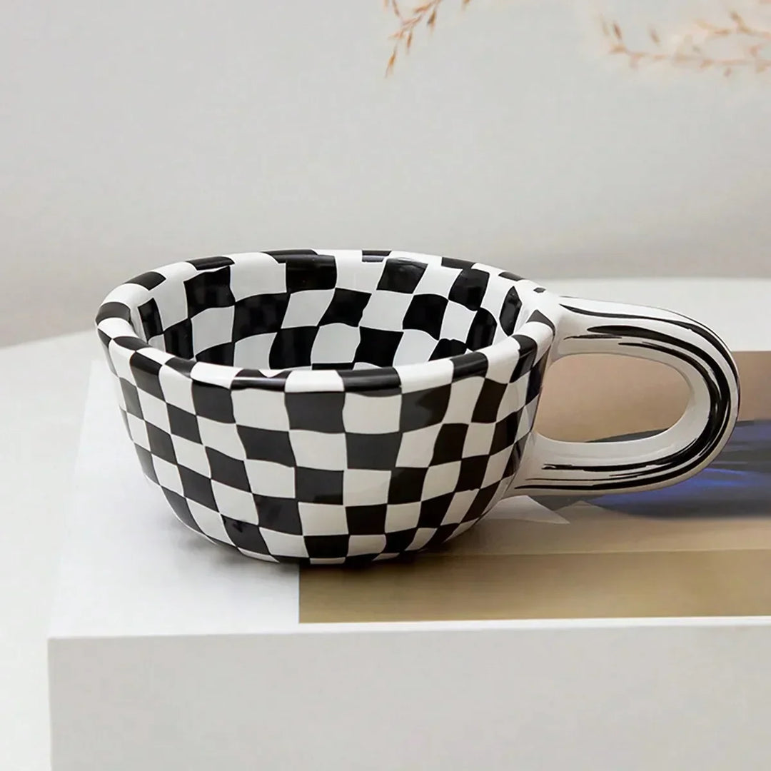 The Checkered Charm Ceramic Mug — styling shot